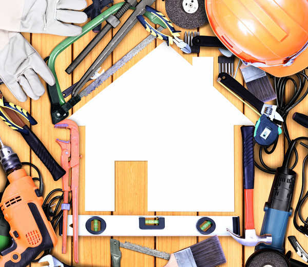 different types of hammers or tools are kept on the brown table